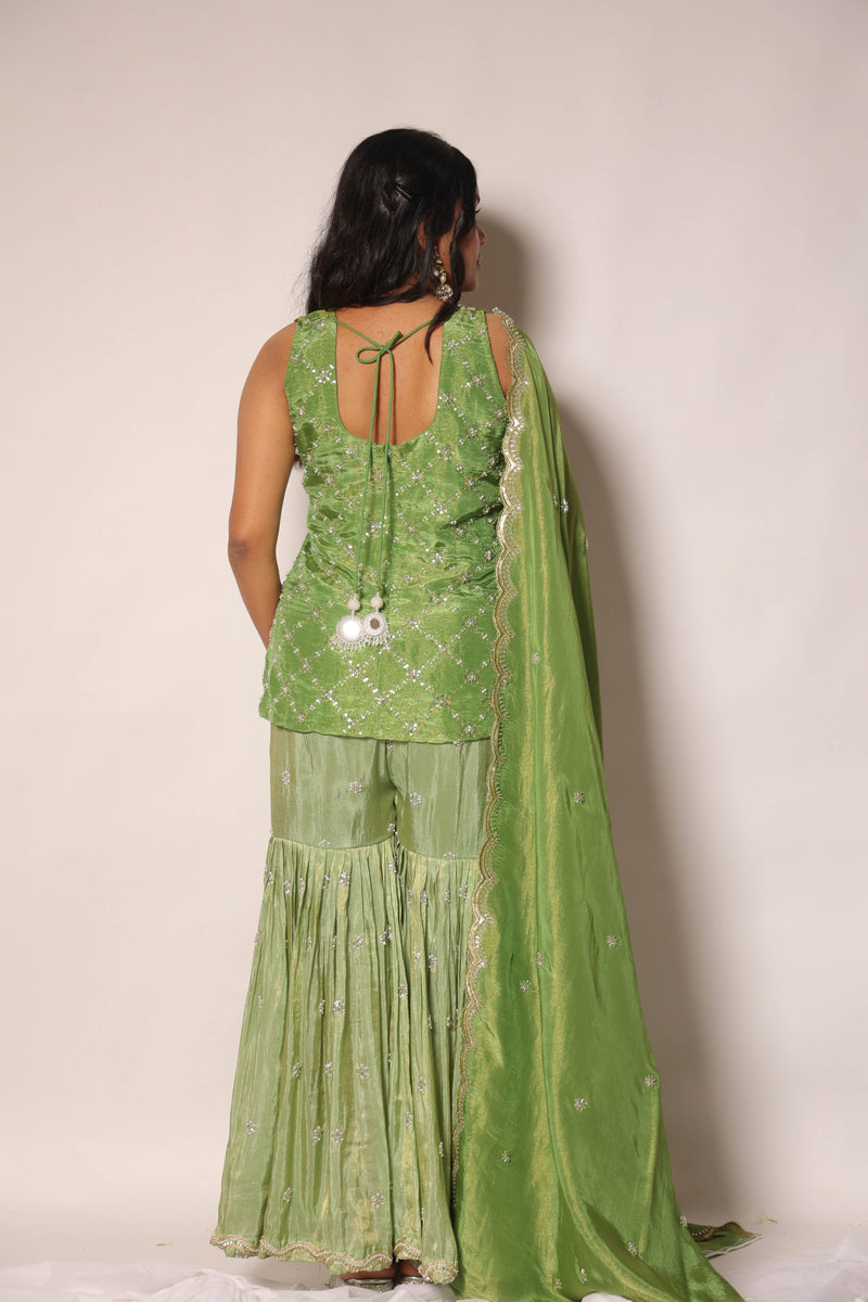 Green embroidered sharara set by Togaa