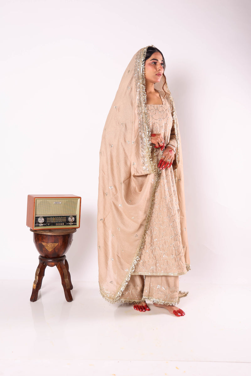 Beige embroidered chanderi kurta set by Togaa
