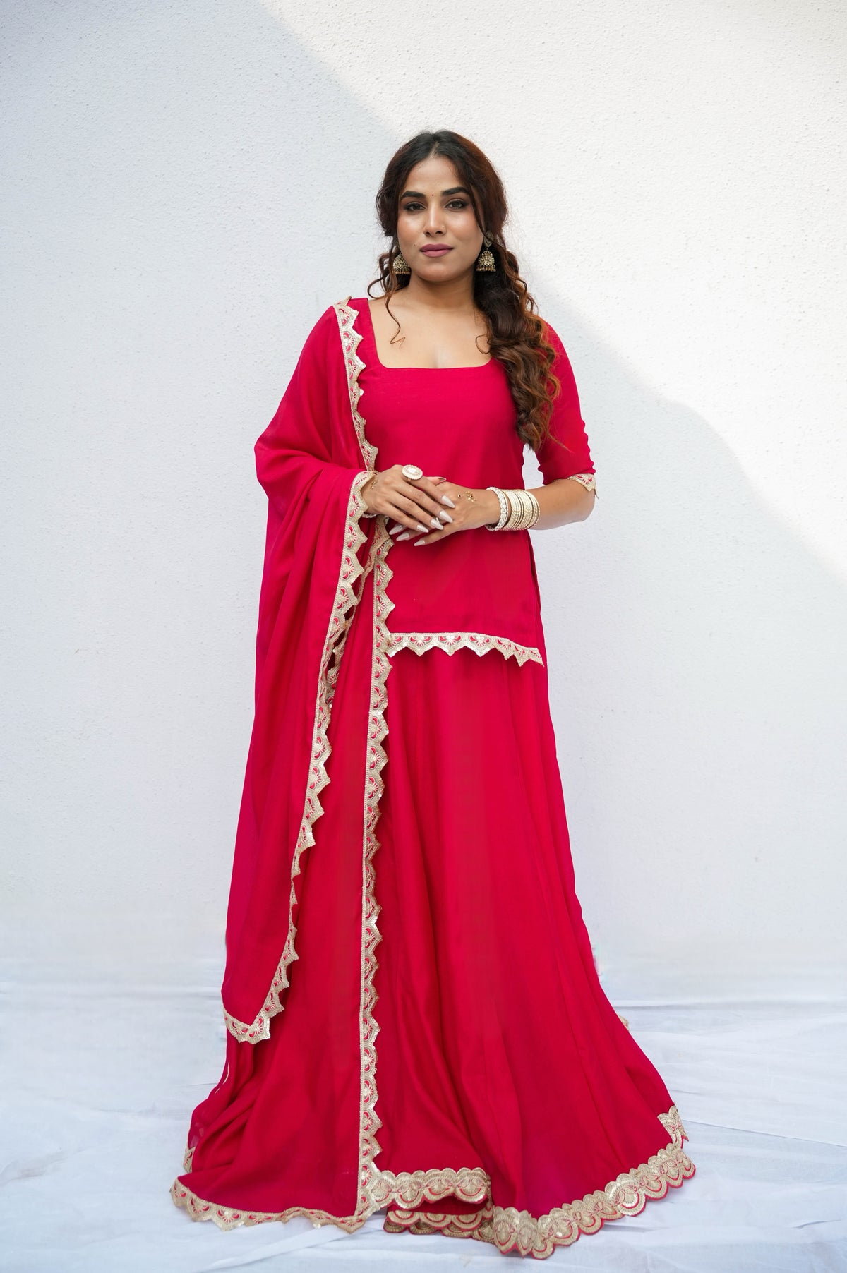 Arohi red skirt set with gold lace by Togaa