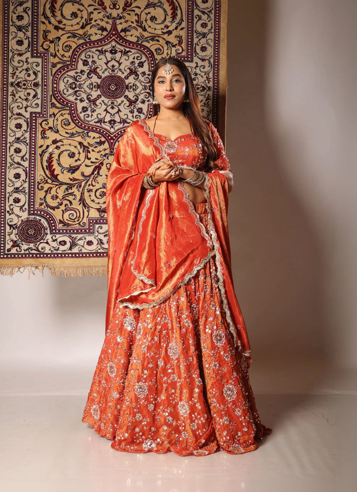 Meera rust embroidered lehenga set by Togaa