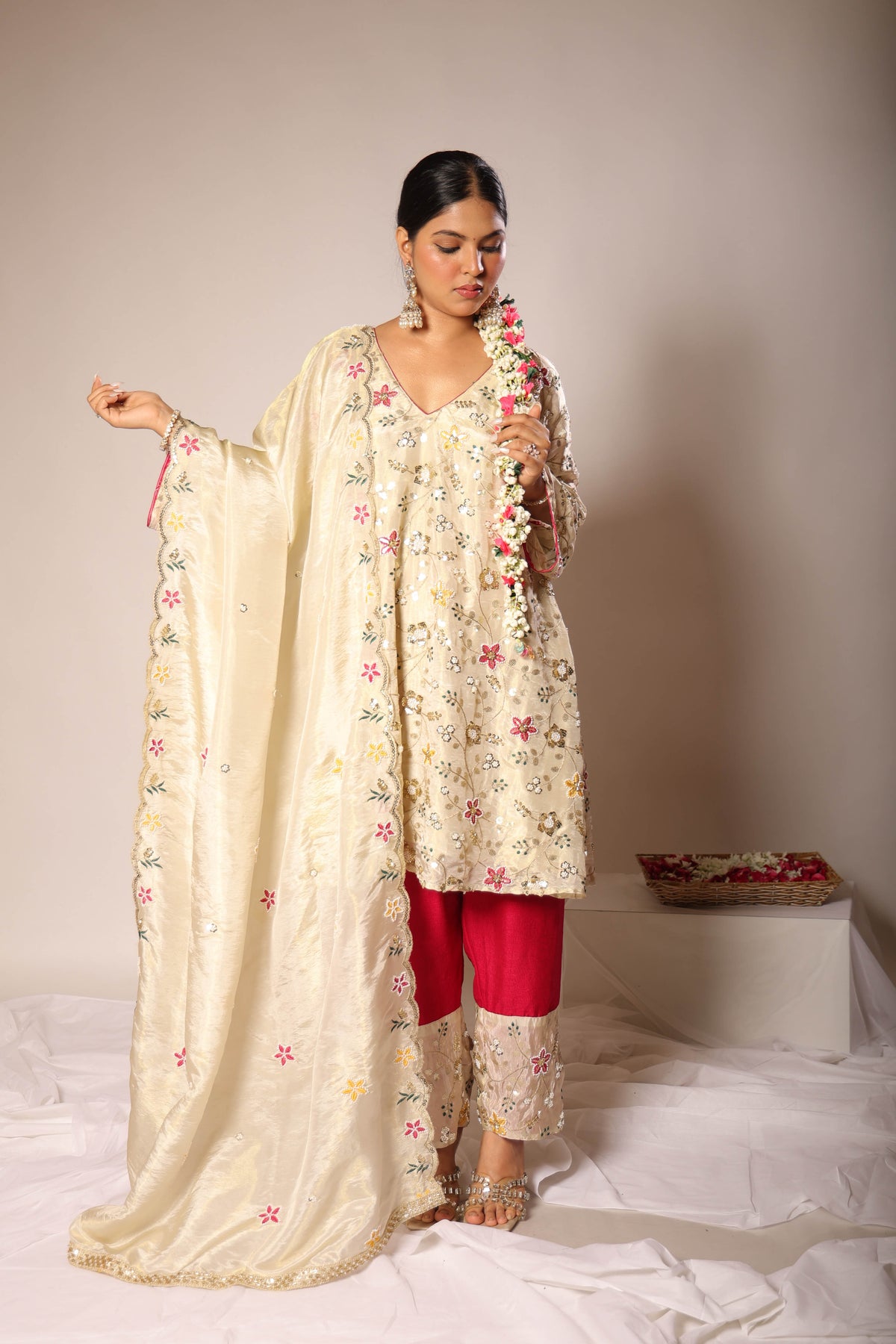 Meher ivory embroidered A-line kurta set with rani-pink pants by Togaa