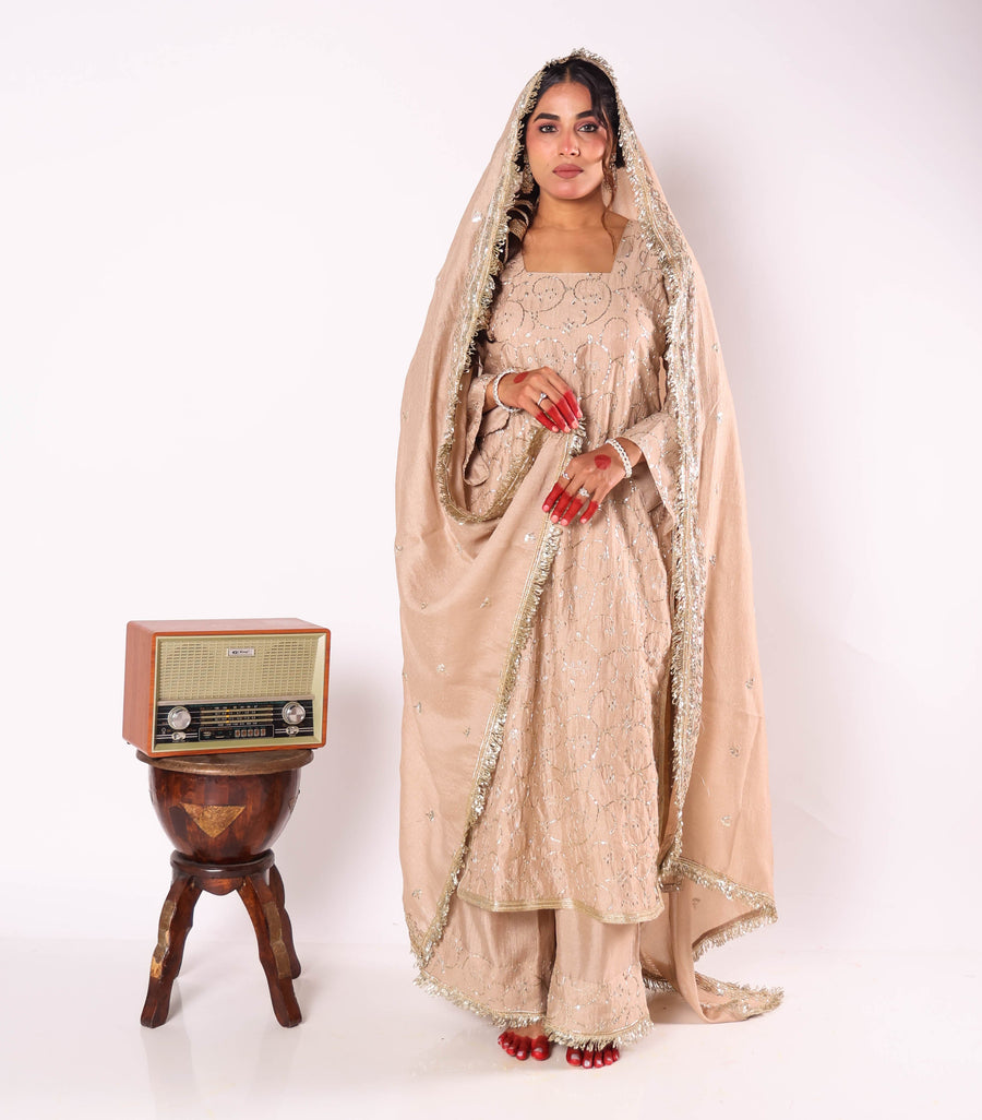 Pravya beige embroidered kurta set by Togaa